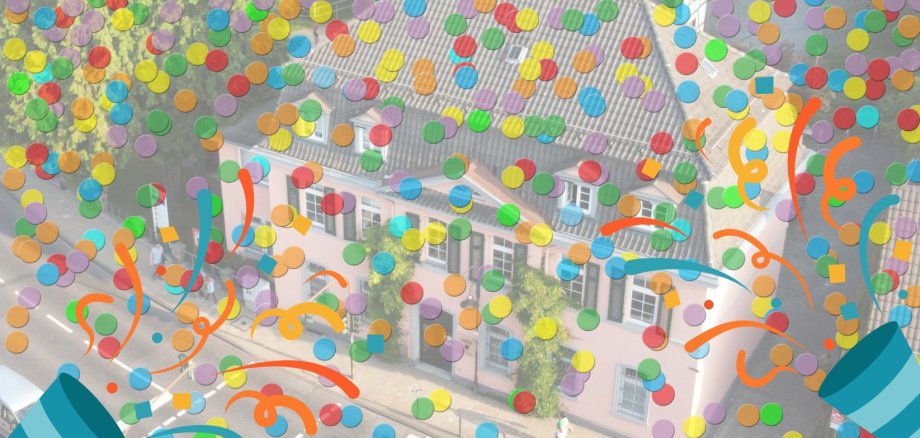 Das Bild zeigt eine Luftaufnahme des Rathauses in Konfettiregen.